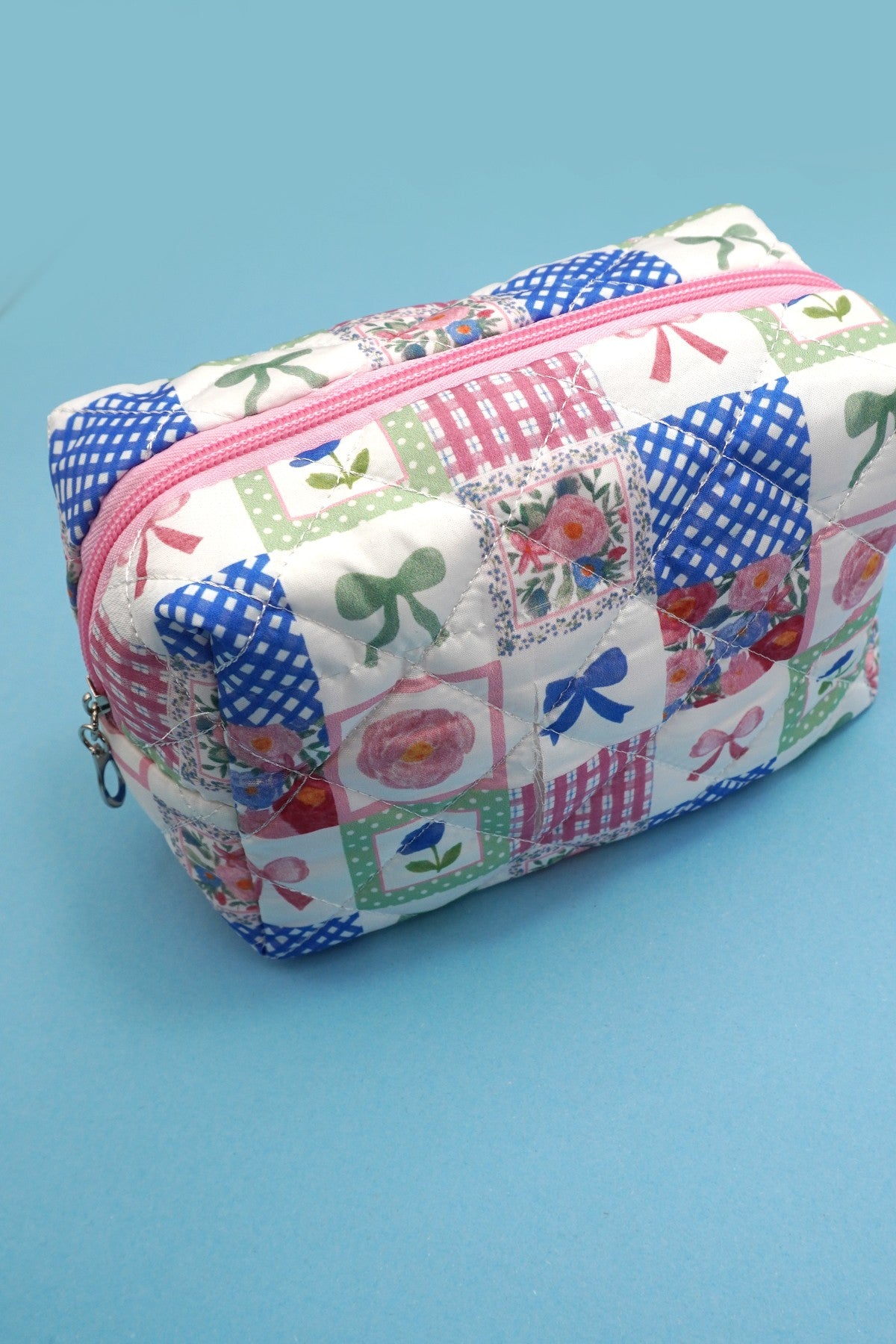 QUILTED FLORAL COSMETIC POUCH