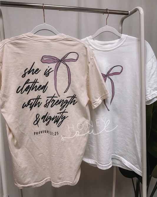 SHE IS CLOTHED TEE